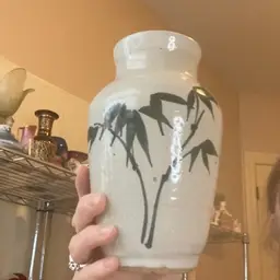 Pottery Vase With Green Plant