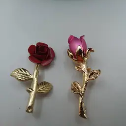 Two gold tone Rose pins , both flowers metal