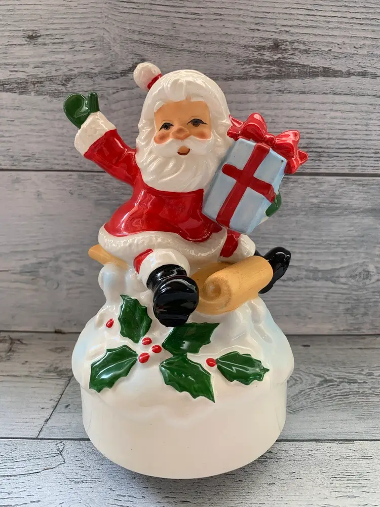 Santa Claus Sledding Christmas 
Musical Figurine
