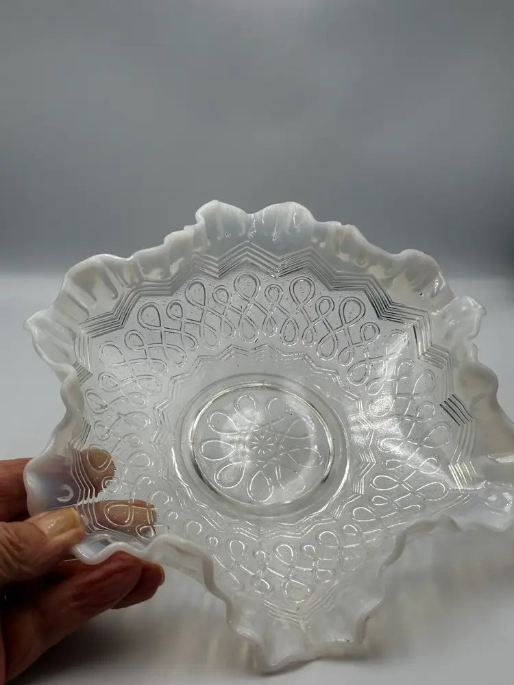 A08 Jefferson Glass opalescent glass bowl with a ruffled crimped edge.
