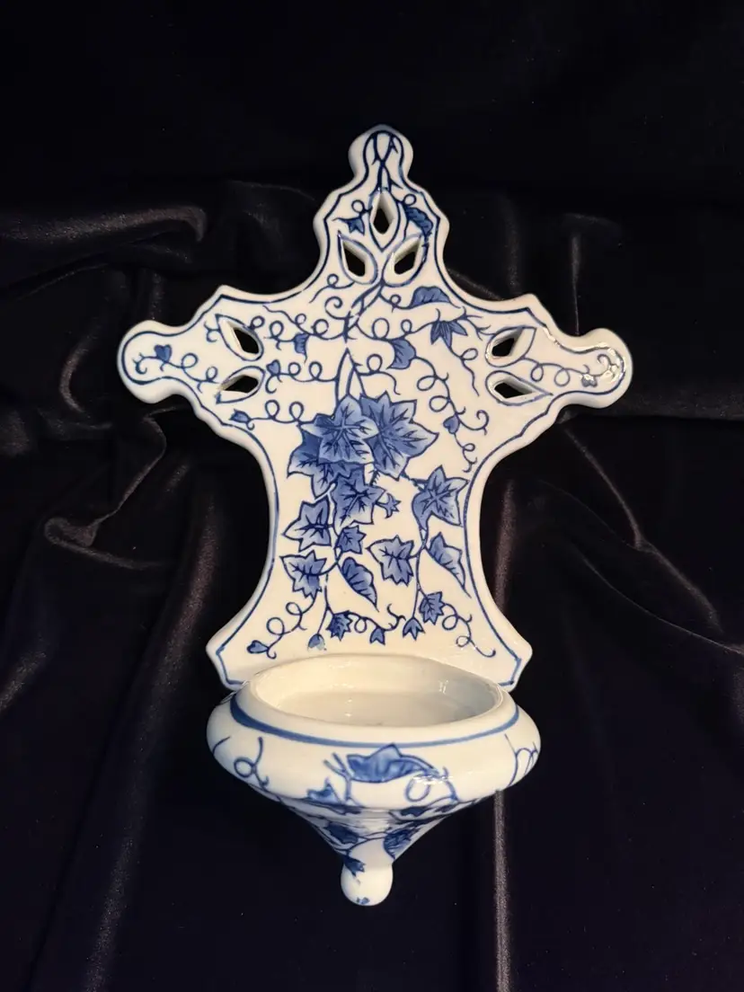 Blue and white porcelain wall-mounted holy water stoup with ivy motif. Can be used as a Pillar candle holder as well.