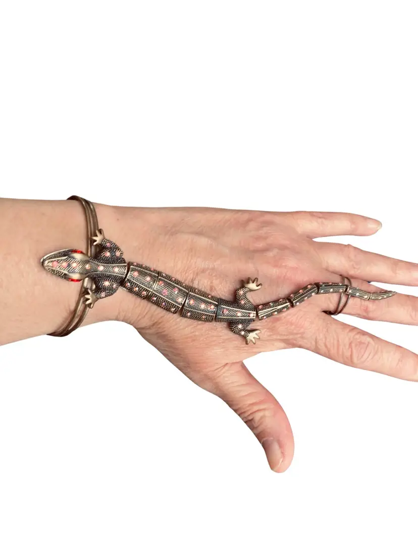 Vintage Salamander - Bronze Brass Set With Aurora Borealis AB Crystals - Slave Bracelet - Jointed - I Showed The Bottom So You Could See The Joints Are Held Together With Strong Springs - High End Designer But It’s So RARE I Couldn’t Find Any Information On It - The Jaw Is Hinged So It Will Open & Close - Absolutely STUNNING!  RARE!  HTF! 
Length of Salamander: 7.5”
Diameter Inside of Bracelet: 2.5” But It Is Brass Therefore It Is ADJUSTABLE. 
Ring: You Can Pick Which Finger The Ring Fits The Best On But The Ring Is Adjustable Just Like The Bracelet Is.