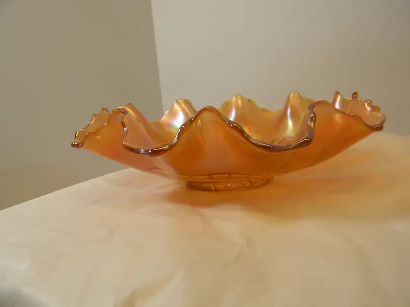 Amber glass with ruffled/crimped edges on the bowl ( 8 1/4" W)