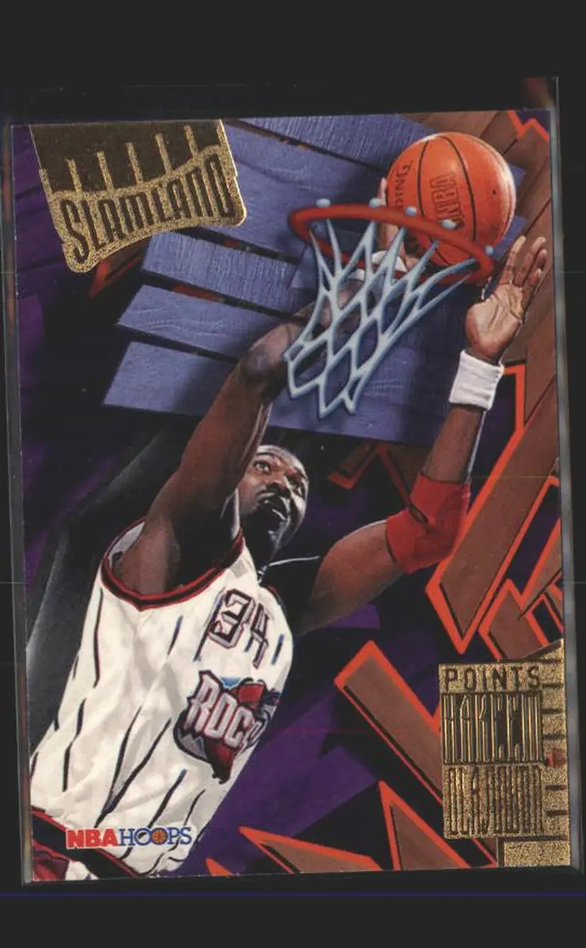 1995-96 Hoops #SL19 Hakeem Olajuwon Slamland - (137) - Houston Rockets