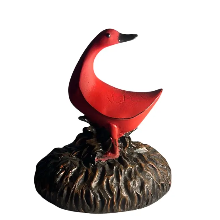 Solid & Heavy Red Duck With 3 Metal Posts To Hold Photographs.
The Base Is Brown To Represent Dirt.