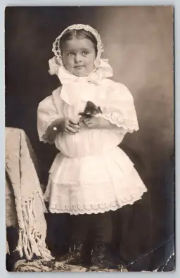 Postcard RPPC Girl in White Gown and Hood and Rings Real Photo Children Holding Something- 9457