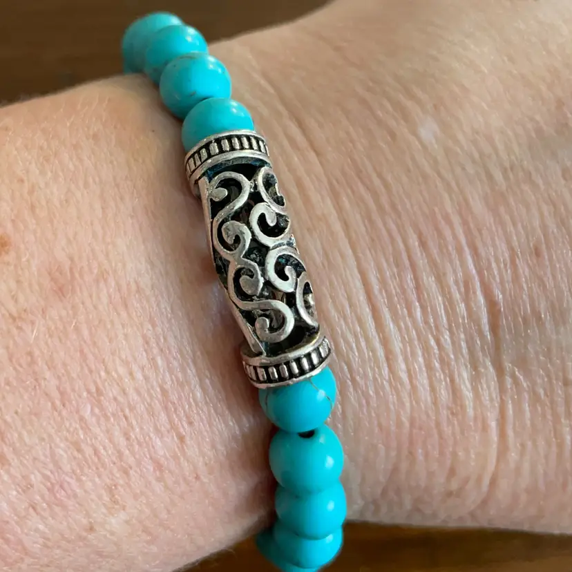 033 Turquoise Colored Beads With Main Silver Tone Charm Bead