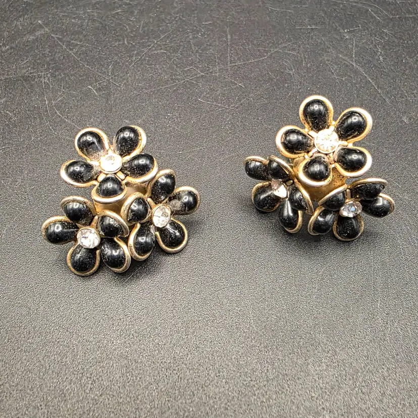 Vintage Cora Black floral roll back riveted earrings
