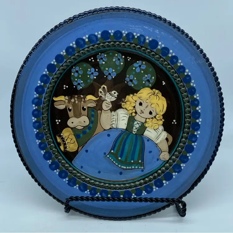 Hand-painted Kohler Biel decorative folk art plate featuring a girl and a cow.