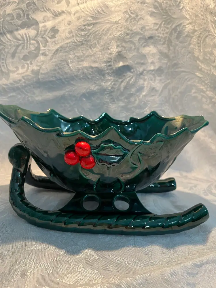 Vintage Lefton ceramic sleigh bowl with holly and berry decorations.