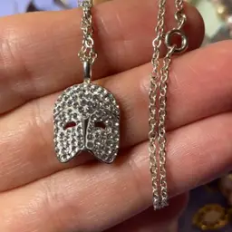 Drama mask pendant on a 19 inch silver tone chain
