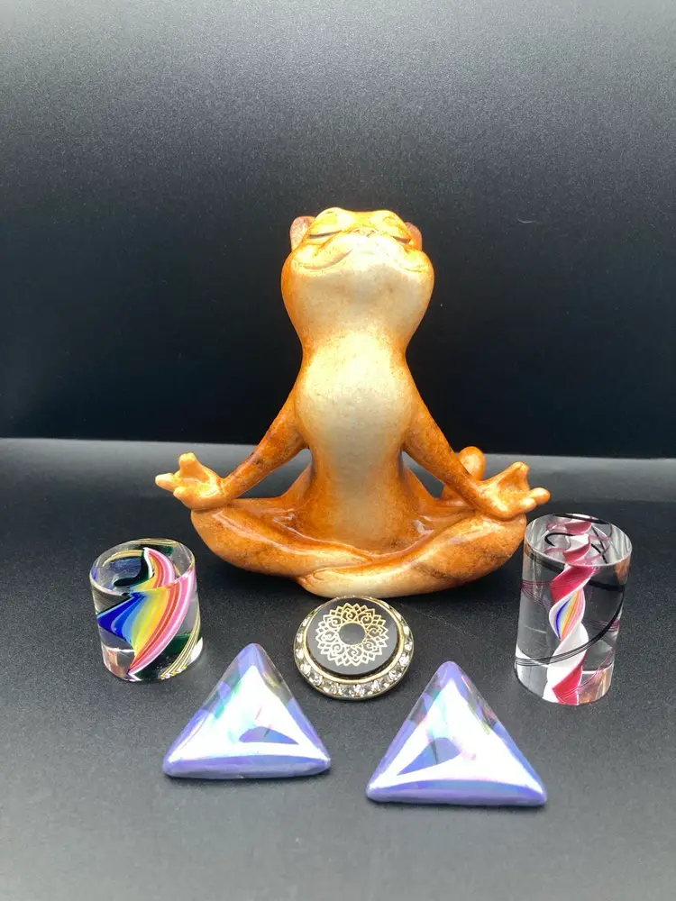Meditating Meow Vignette! Meditating Kitty (4 1/4” Tall 4 1/4” Wide) Miniature Glass Rainbow Swirl Paperweight (1” Tall 1” Wide) Miniature Glass Spiral Paperweight (1 1/2” Tall 1” Wide) Pierced Earrings (1 1/4”) Single Rhinestone Clip On Earring (1” Diameter)