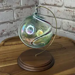 hand-blown glass witch ball, also known as a friendship ball with Swirls