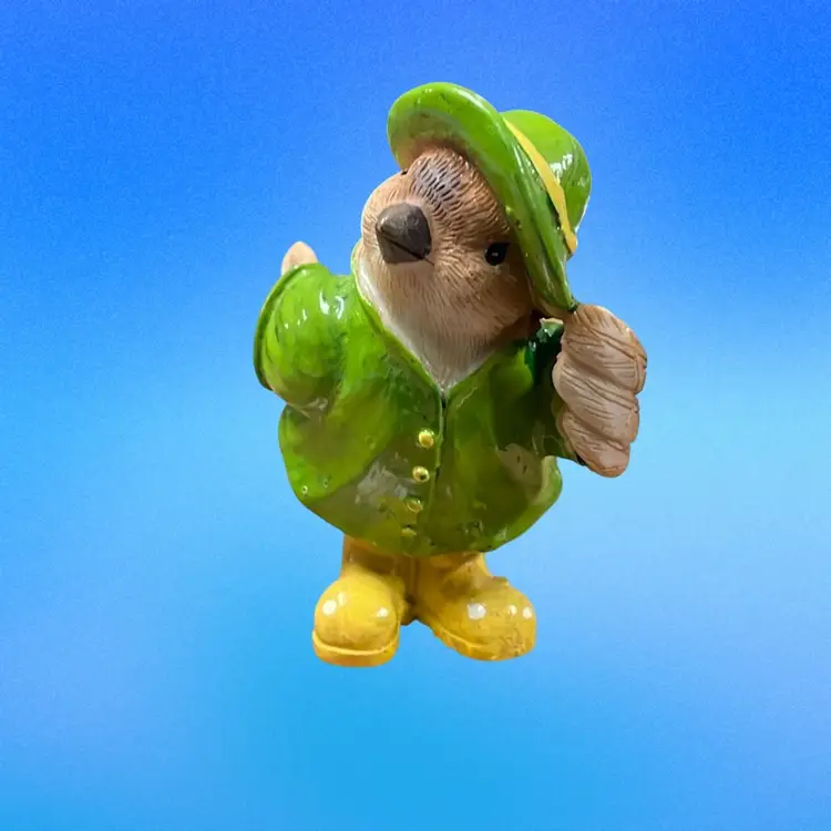 Small Ceramic Bird Wearing Green Slicker