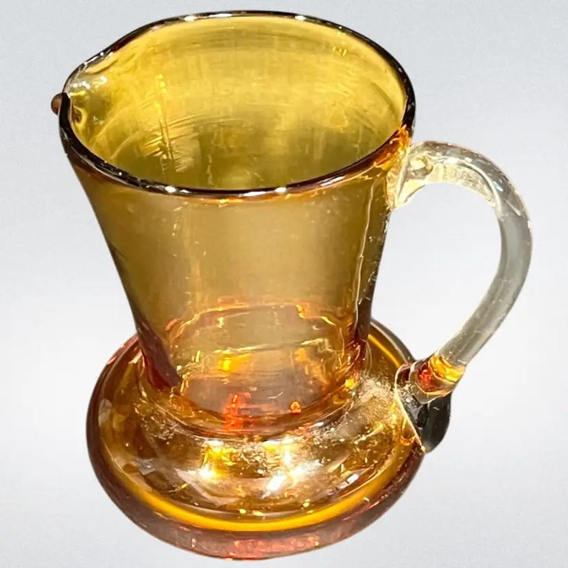 Hand-Blown Amber Art Glass -Mini Pitcher with Clear Applied Handle-3.5” Tall, 3.5” Wide, 2.5” Diameter Base