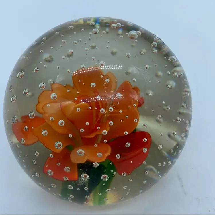 #0053 Vintage glass paperweight with an orange flower and controlled bubbles.