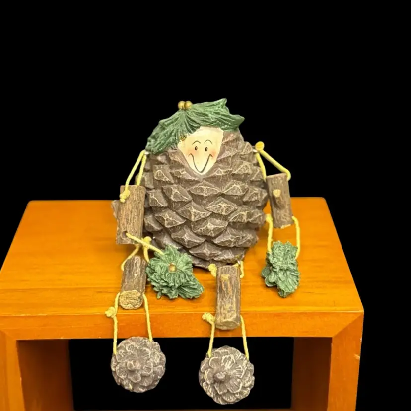 Pine Cone Shelf Sitter Anthropomorphic Kitsch Brown Green Acorn Feet Tree Branch Arms Fall Decor 
3” T (sitting) x 3”L x 2-1/2” W