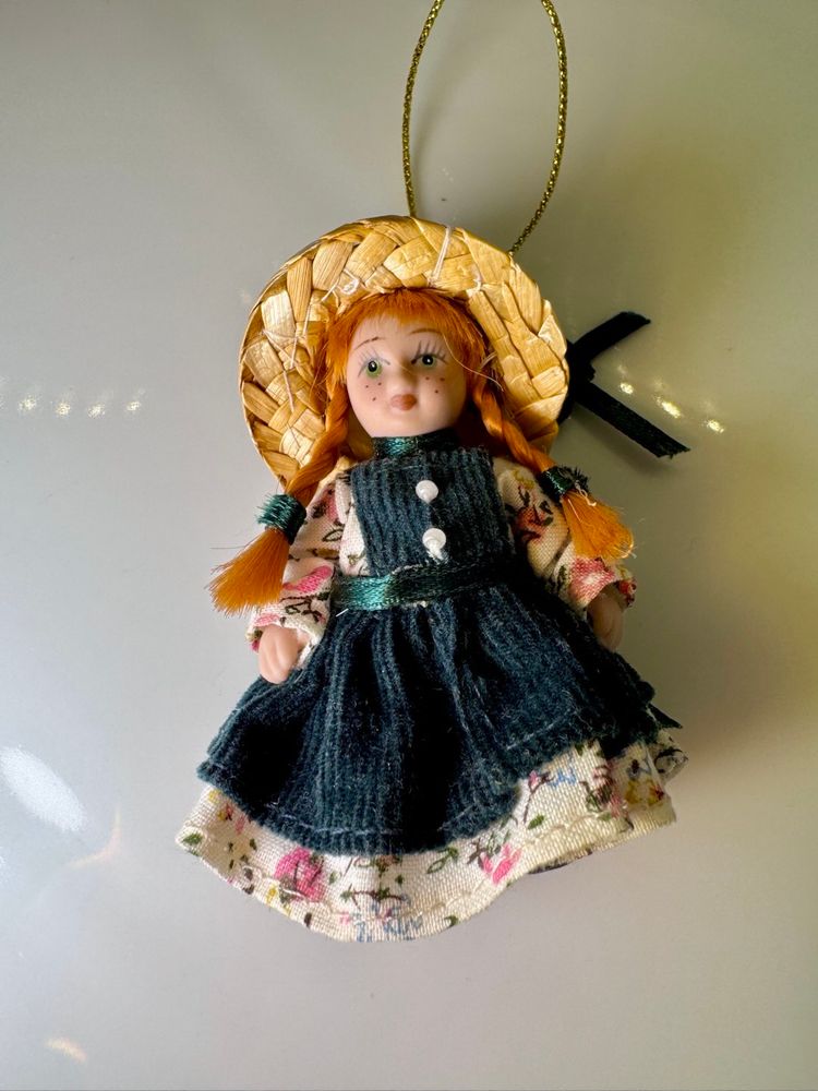Vintage porcelain doll of Anne of Green Gables.