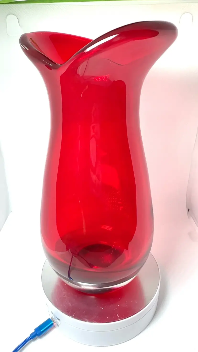 Vibrant Red Glass Flower Vase. Sticker On Bottom “Rubies & Roses. Teleflora Gift”. Heavy! Weighs 3-1/2 lbs. 9-1/2” Tall x 5” Across Widest Mouth x 4-1/2” Across Widest Bottom.