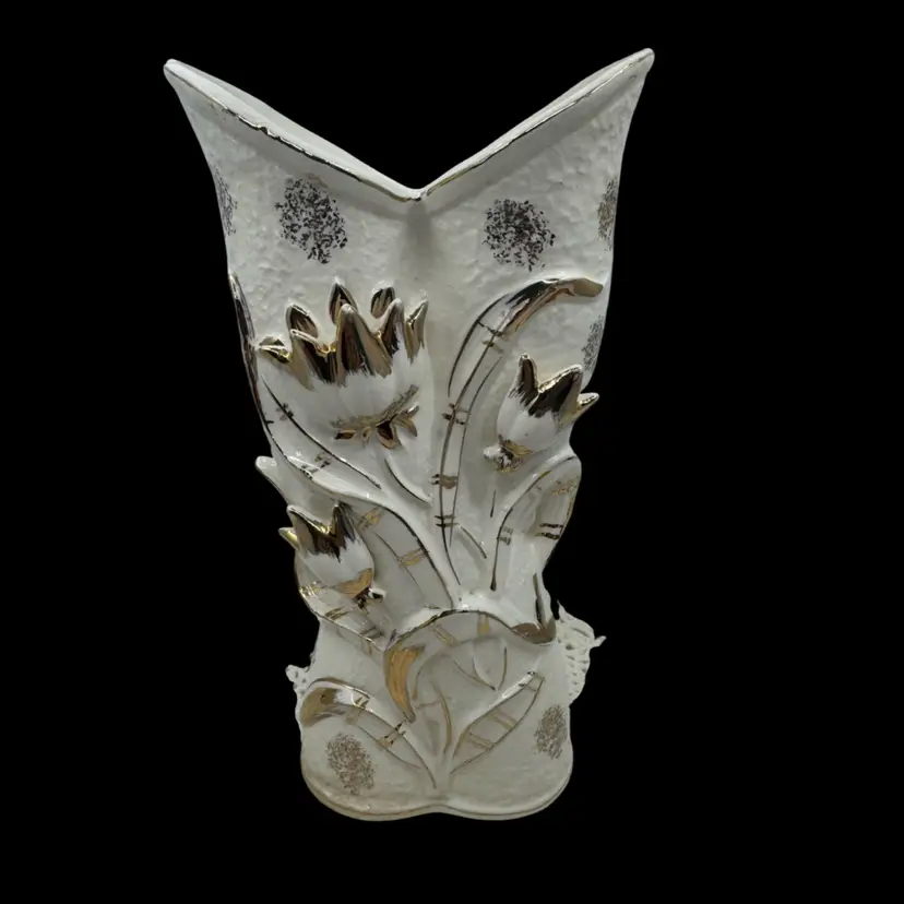 White porcelain vase with raised gold floral design and angular rim. Crazing