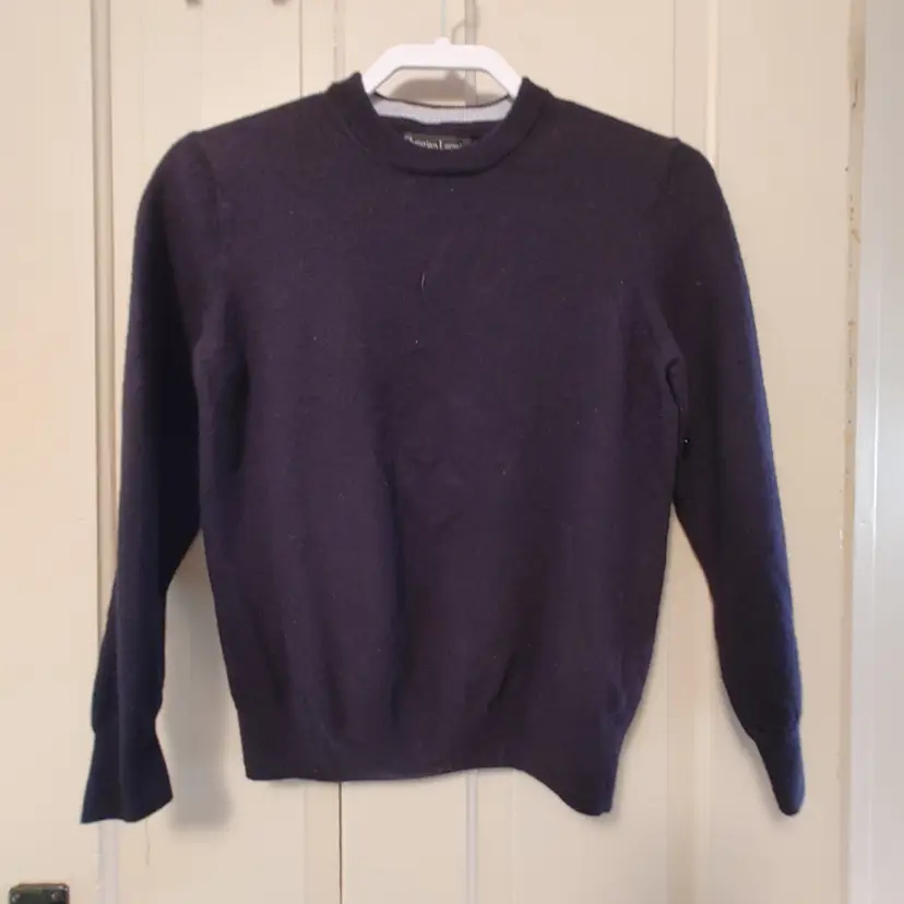 Top- Brand: Christian Lacroix. Black sweater top. Size Medium. Material- 100% extra fine merino wool. No callouts.
