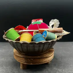 #184A Beautiful Vintage Hammered Copper Ribbed Bowl Filled With Vintage Sewing Notions. Spools Of Thread, Lace Remnant, A Pincushion, Pack Of Needles, Measuring Tape, Pattern Tracing Tool, Etc.