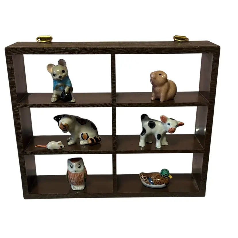 small, dark hard plastic wood trinket display shelf 6” L, 5” H & 1.5 W.