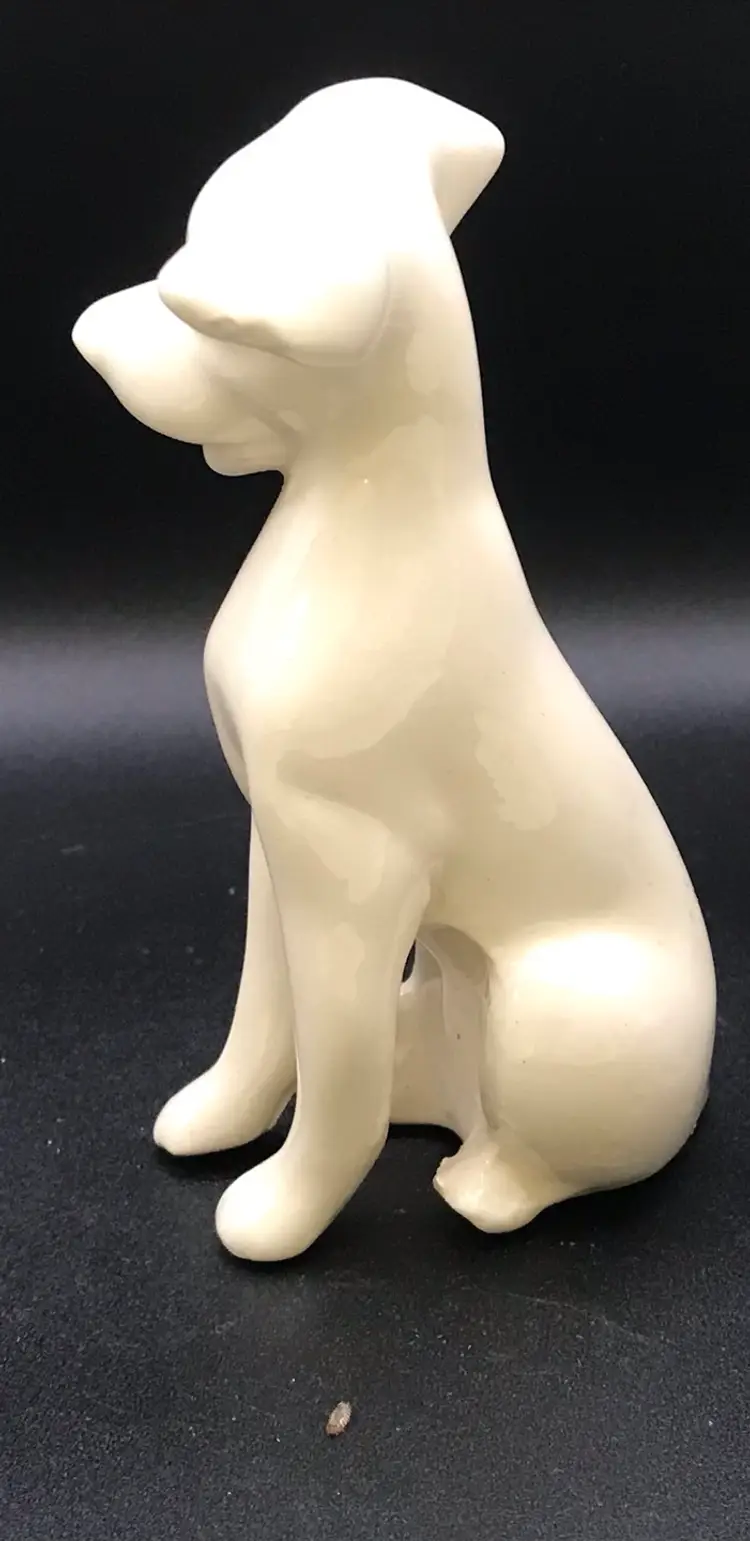 Ceramic sitting white dog figurine