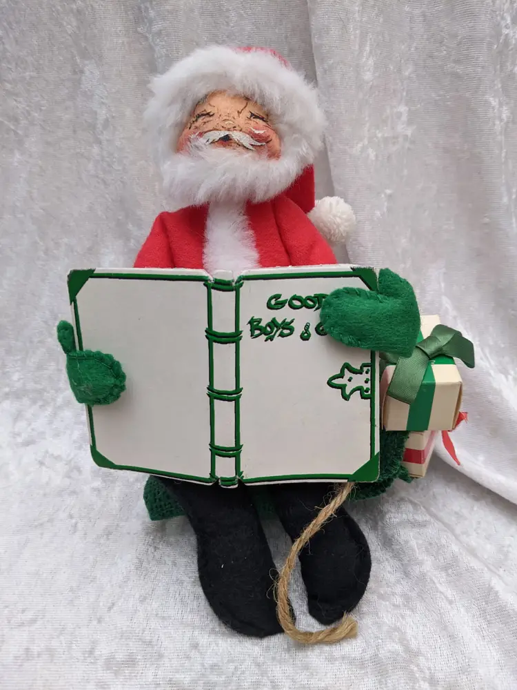 VTG Annalee 8" Santa Mobilitee Doll sitting on his bag Bag with  Presents reading a book of Good Boys Girls Christmas decor . He is 7in wide and 8 in tallVery good  condition Clean with no damage. no weird smells. Please check the photos for details. Comes from a smoke free home. We do have pets.