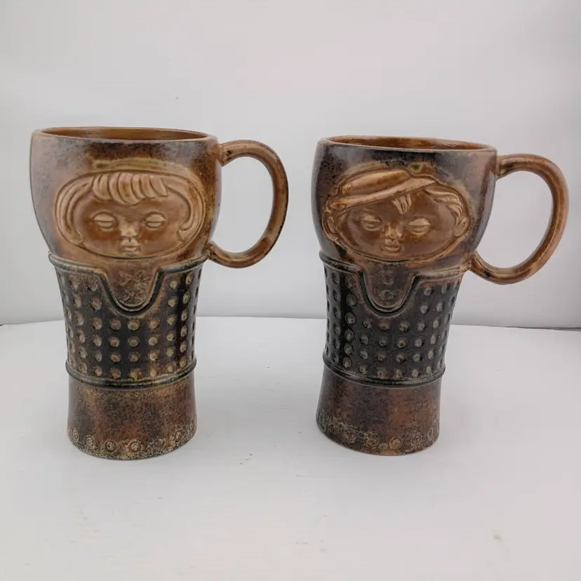 Pair of Holt Howard stoneware face mugs