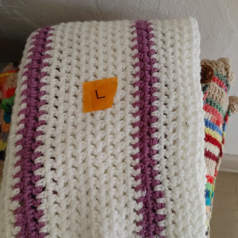 Afghan L- approx size 36 x 24. White with purple. As shown.