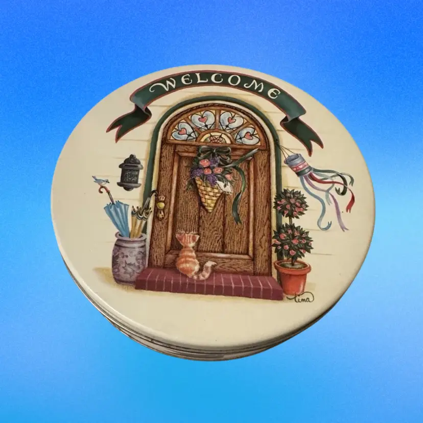 A decorative collectible tin or plate from the "Cozy Country Corners" series