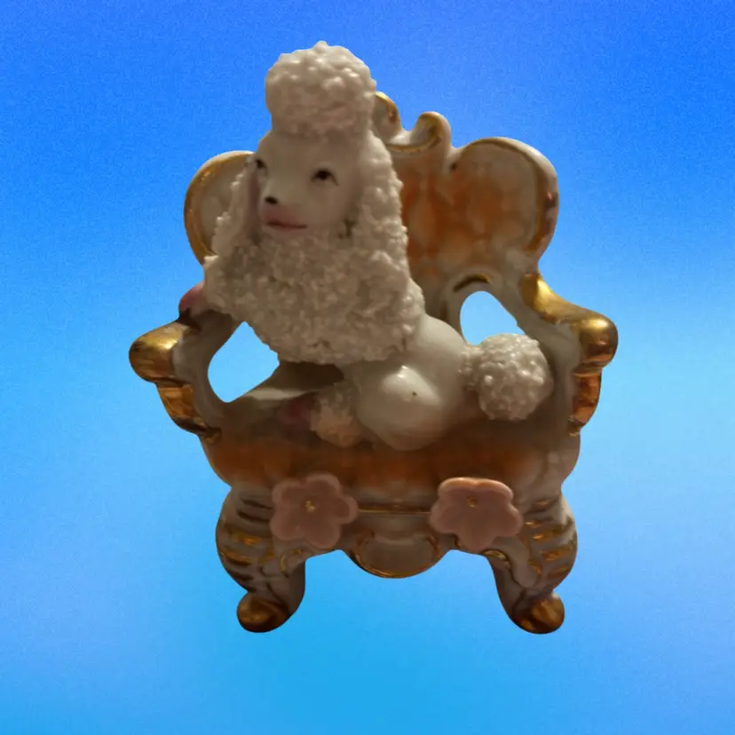White Porcelain Spaghetti Poodle Figurine Sitting On An Elegant Gold Trimmed Chair