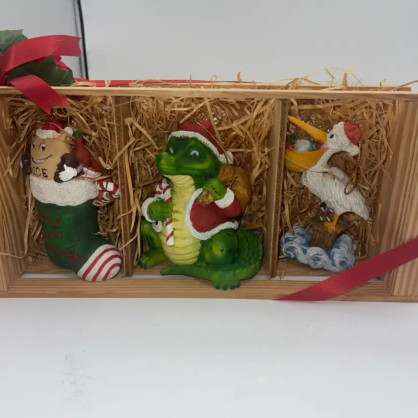 Cajun Themed Christmas Ornaments Displayed in a Wooden Crate