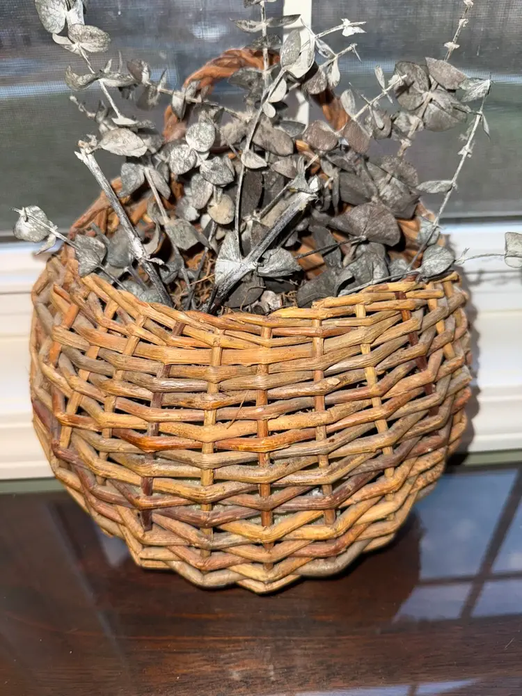 Vintage Woven Wicker Wall Pocket Hanging Basket with eucalyptus; country decor