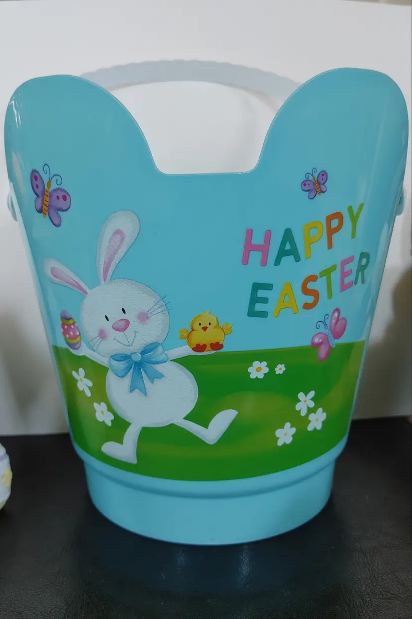 Blue Easter Pail with Easter Bunny. 8.25 inches high.