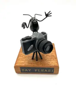 05 - Vintage “Say Fleas” Florida Sand Fleas Camera Cameraman Whimsical Metal Sculpture.