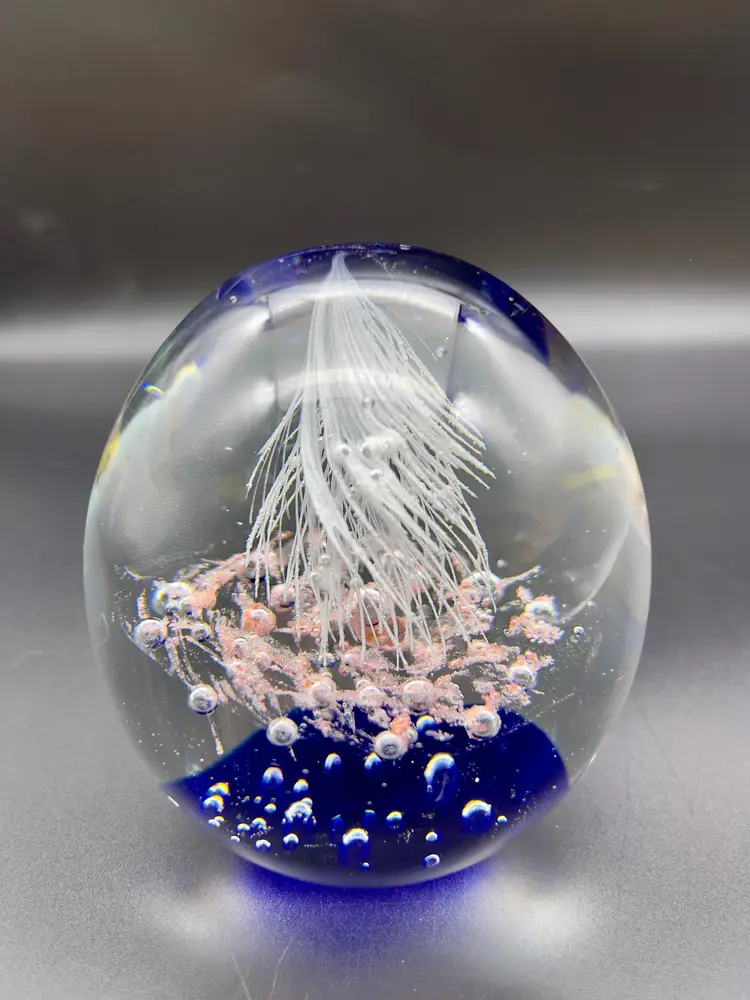 Vintage rounded hand-blown art glass paperweight.