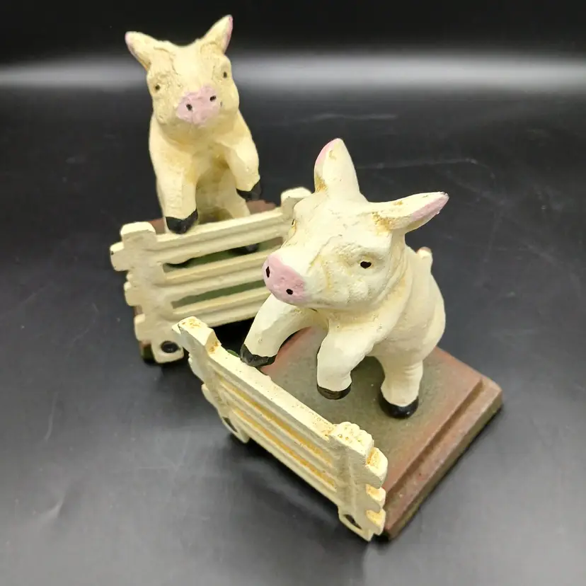 Cast Iron Painted Bookends, Pair Of Pigs Jumping White Fence