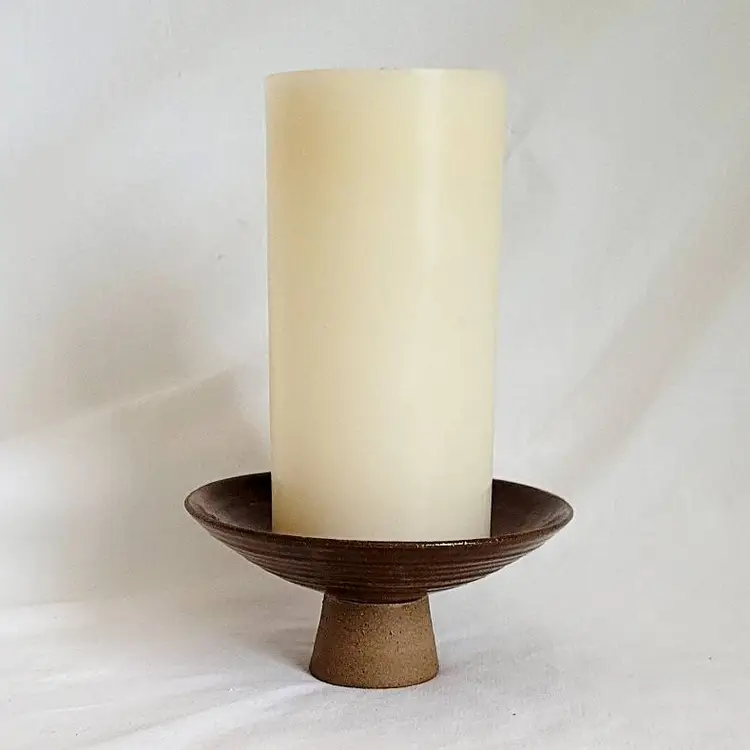 Brown Pottery Candle Holder With Candles