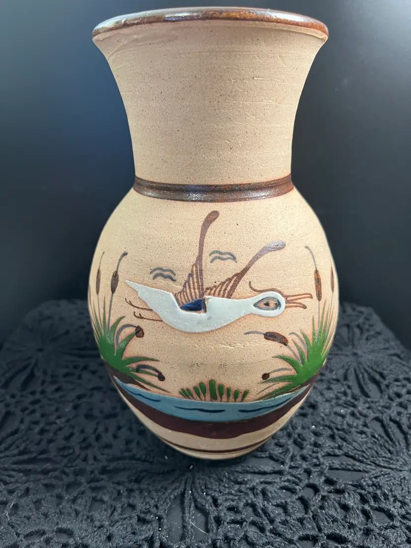 Hand Painted Mexican Pottery Features a Bird Among the Cat Tails Above a Pond