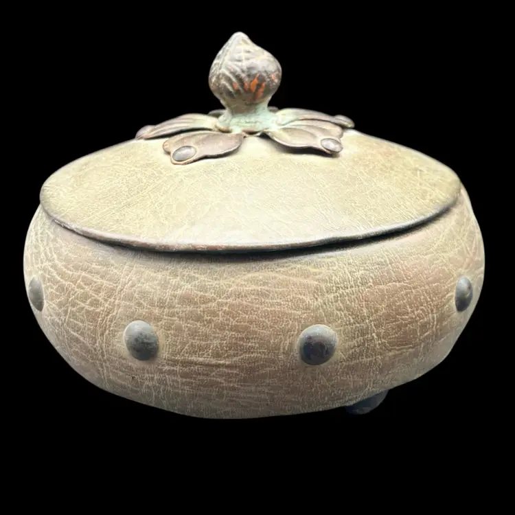 #181A Vintage Wooden Trinket Box Featuring a Textured Leather Covering With Decorative Studs Around The Bowl and a Metal Floral Finial on the Lid and Three Ball Feet