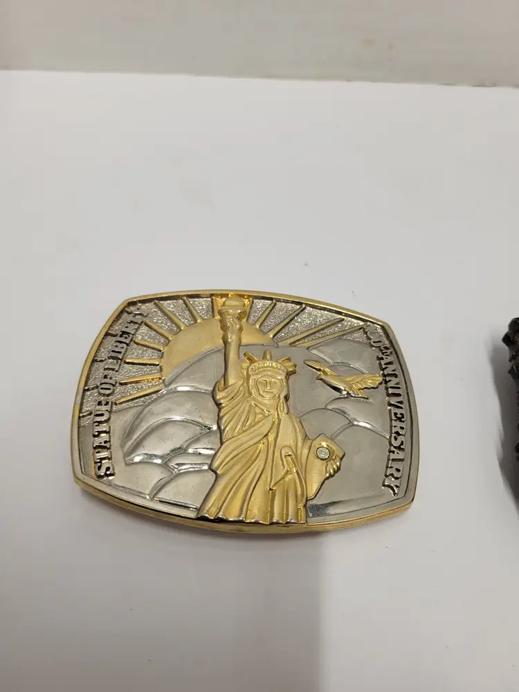 2 belt buckles pheasant and statue of liberty