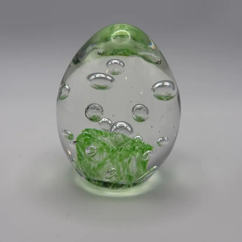 Clear And Green Egg Shaped Paper Weight With Controlled Bubbles.