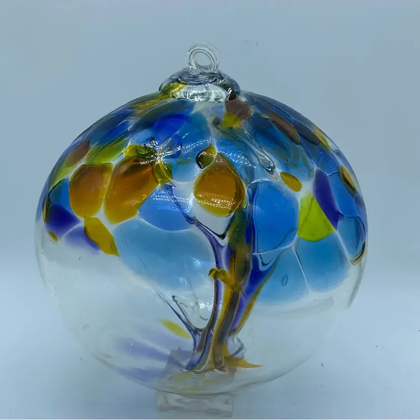 #1221 A 6-inch blown glass witches ball celestial orb with swirling colours And Tree Of Life. 6”
