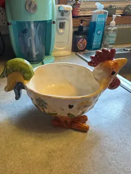 Ceramic rooster-shaped decorative bowl.