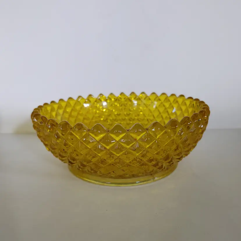 Yellow pressed glass bowl. 6.5 inch diameter. No chips or cracks.