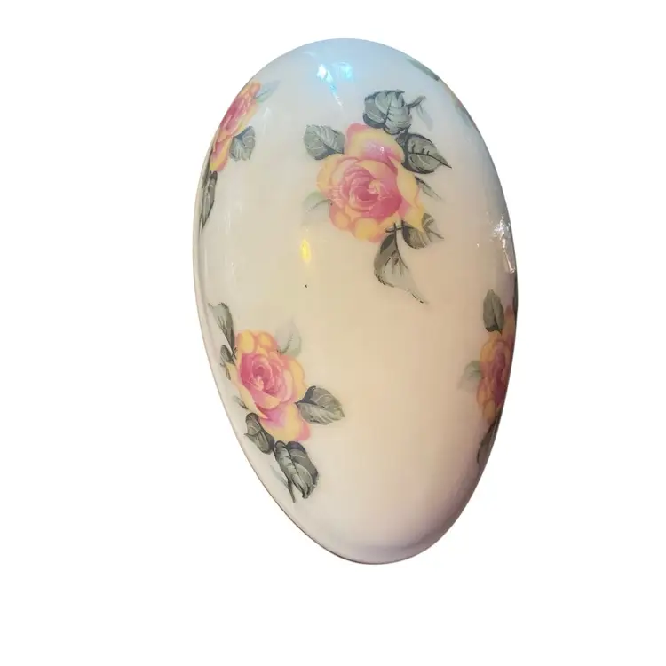 This vintage Norleans Japan egg trinket box is a beautifully crafted porcelain piece featuring delicate floral rose patterns and gold trim