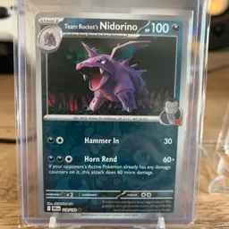 Team Rocket's Nidorino Pokémon card, number 118/182 from the Destined Rivals set (SV10).