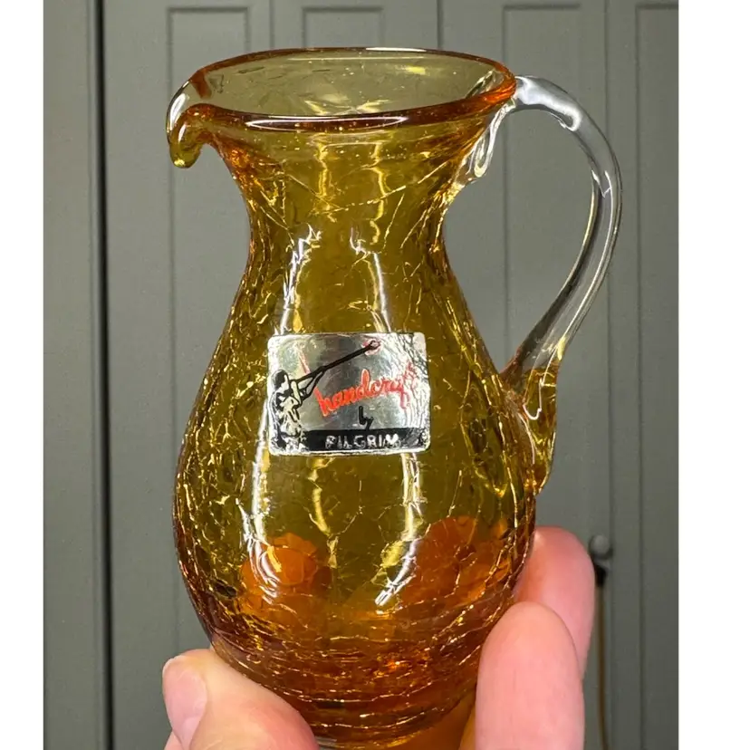 Vintage 4” amber crackle glass pitcher made by the Pilgrim Glass Company